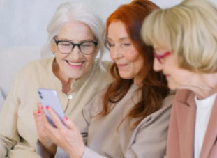 women reading a message happily